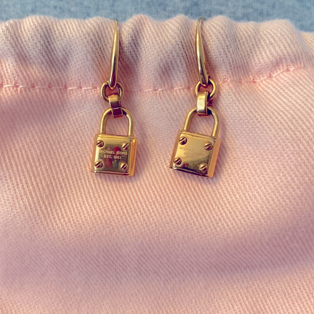 Micheal Kors rose gold earrings.